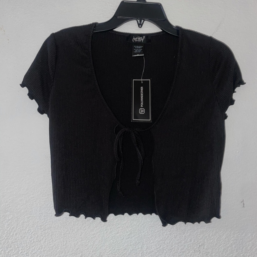 New black tie in the front top. Women’s size Small